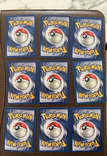 9 holo cards from the sets of base, jungle, fossil and team rocket back in 1999